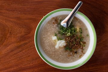 asean congee served on wooden table