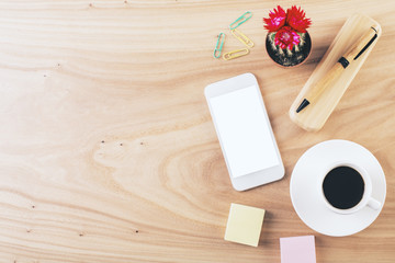 Desktop with smartphone and coffee