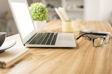 Blank laptop on desktop