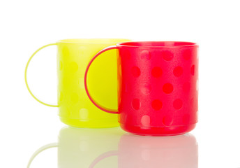 Colorful plastic cups isolated on white.
