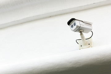 The CCTV Security Camera operating in the white terrace backgrou