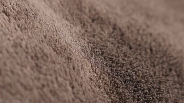 Polar wool synthetic fibers of polyester warm blanket close-up 4K 2160p 30fps UltraHD video - Polar fleece brown fabric structure texture 4K 3840X2160 UHD footage 