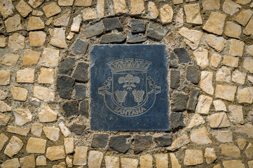 Santana district emblem on the stone pavement. Madeira island