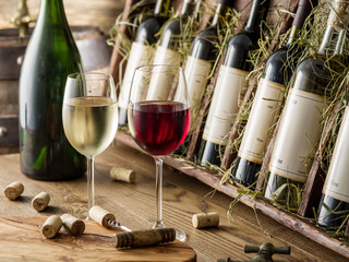 Wine bottles on the wooden shelf. © volff