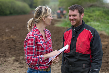 farmer dealing with pesticide saleswoman