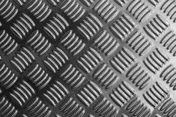 metal plate close-up in black and white scene,emboss pattern texture of metal plate or metal sheet for anti-slip