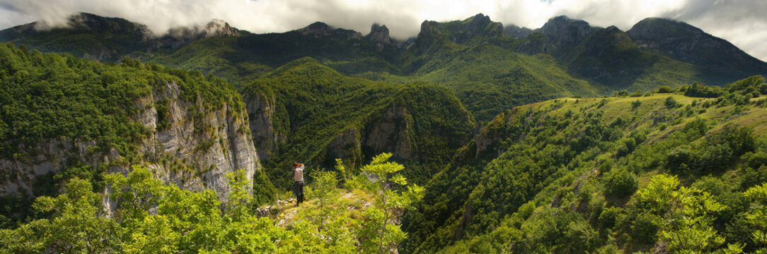 Man Taking Photo of Canyon of Komarnica River, Montenegro