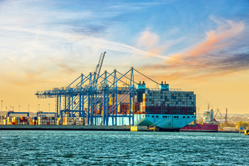 Container ship loading in port of Gdansk, Poland.