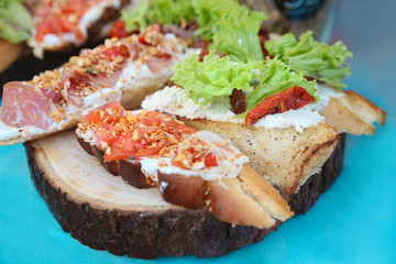 Sandwiches on wooden background