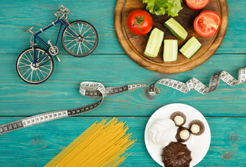 Choice of food: diet, vegetables and sports or cake, candy 