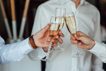 three Successful businessman toasting Champagne