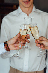 three Successful businessman toasting Champagne