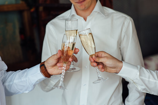 three Successful businessman toasting Champagne