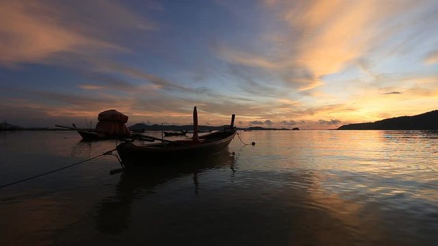 Longtail boat in sea at sunrise time