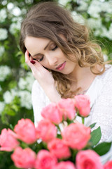 Fototapeta premium Woman with roses / pretty woman with a bouquet roses