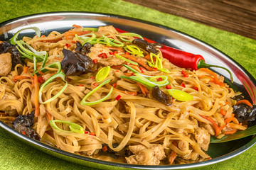 Asian noodles with mushrooms, herbs and chili
