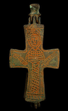 Ancient copper Byzantine cross in brown patina