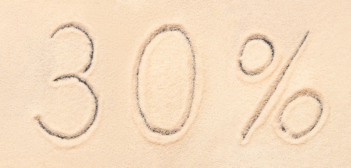 30 % lettering written on sand