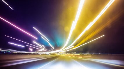 Blurred Abstract image of Long exposure night traffic light in the city