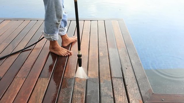 Outdoor wood floor cleaning with high pressure water jet