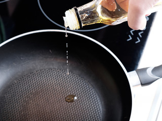 Pouring oil into the frying pan