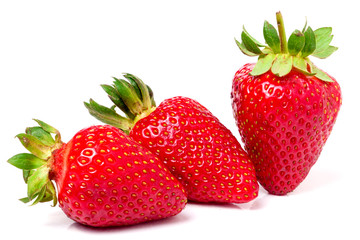three strawberries isolated on white background close-up macro