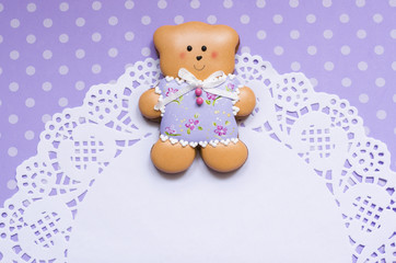 Polka-dot background with a honey-cake bear and a napkin