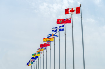Obraz premium Picture of the canadian Flag along with the flags of the 10 Canadian Provinces and the 3 Canadian Territories, in Ottawa, Canada