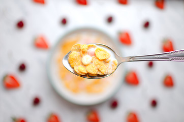 Corn flakes with fruits pattern on a marble