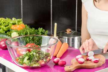 Cutting radish to a salad