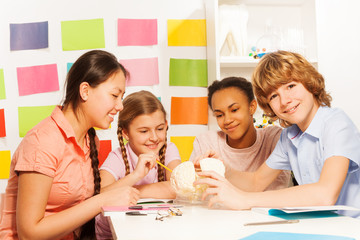 Four smiling teenagers at the anatomy lesson