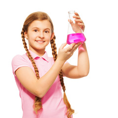 Young scientist pouring chemicals at the flask