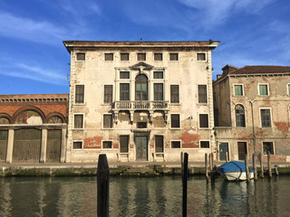 Naklejka premium Canal front old building in Sunny Venice, Italy