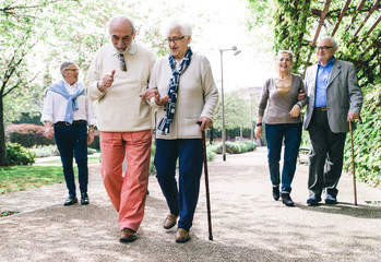 Group of old people walking outdoor