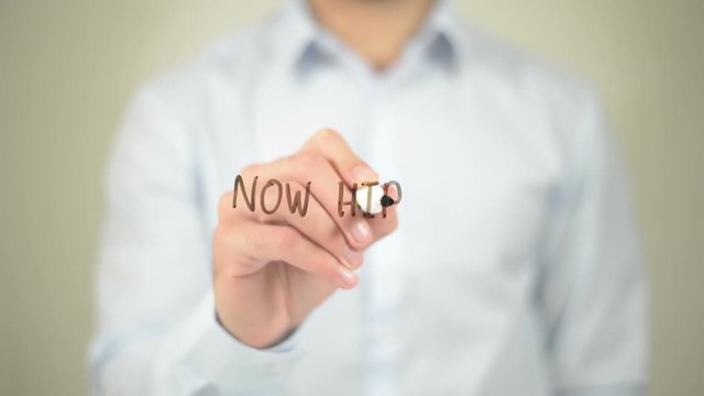 Now Hiring,  Man writing on transparent screen