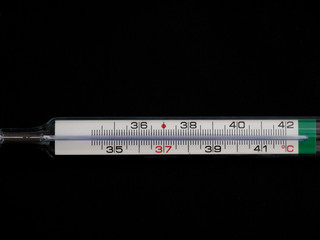Thermometer on black background