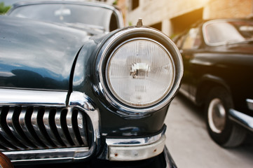 Old vintage car headlight close up.