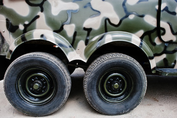 Obraz na płótnie Canvas Two twin wheels at military truck jeep car