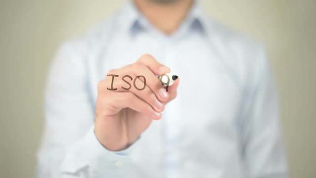 ISO 9001,  Man writing on transparent screen