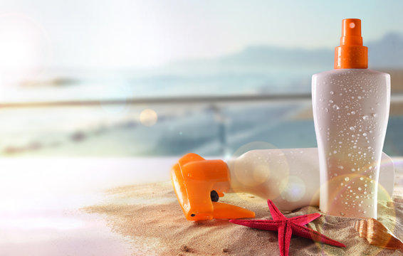 Two sunscreen on table in terrace overlooking beach