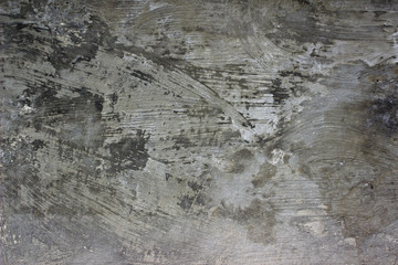 Od grunge wall, concrete texture with rough brush strokes. Old gray wall urban background.