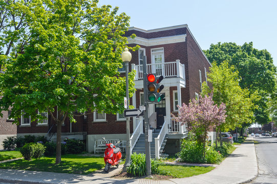 Red traffic light in old Westmount neighborhood.