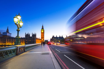 Fototapeta na wymiar London scenery at Westminster bridge with Big Ben and blurred red bus, UK