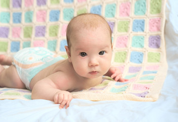 Happy baby lying on his stomach