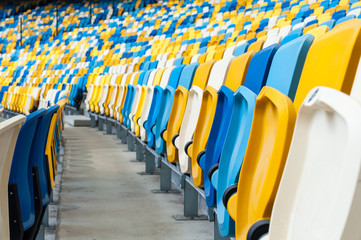 Naklejka premium Empty plastic seats in a footbal or soccer stadium. 2016 sport background