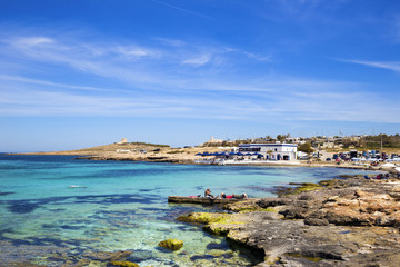 Fototapeta na wymiar Palm beach, Malta on a sunny day with blue sky