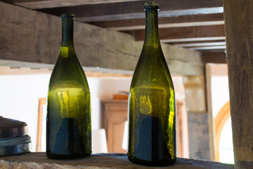 Two old dark green Normandy cider bottles