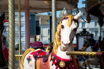 Bright vintage carousel in a French Honfleur.