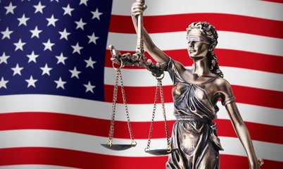 Themis with scale, symbol of justice on USA flag background
