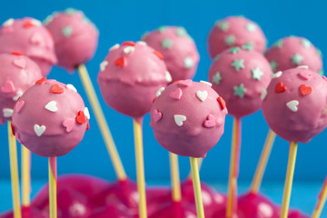 Homemade Cake pops with pink chocolate glaze, and hearts 